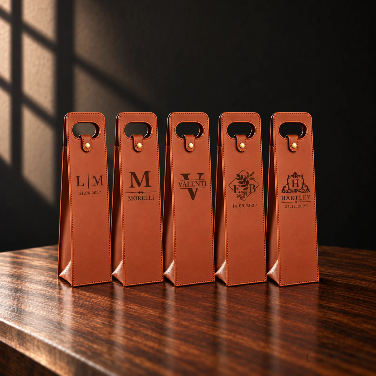 Five Conegliano Cognac wine carriers showing engraving examples I, J, C, G and L