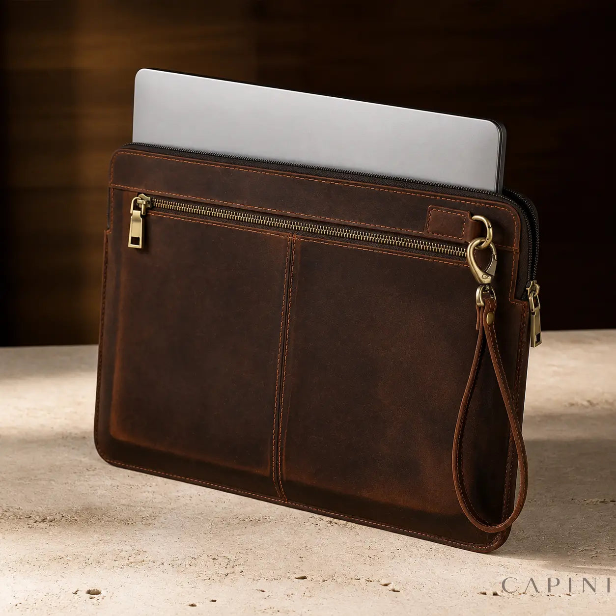 Spoleto Crazy Horse MacBook Sleeve in Espresso with a silver MacBook
