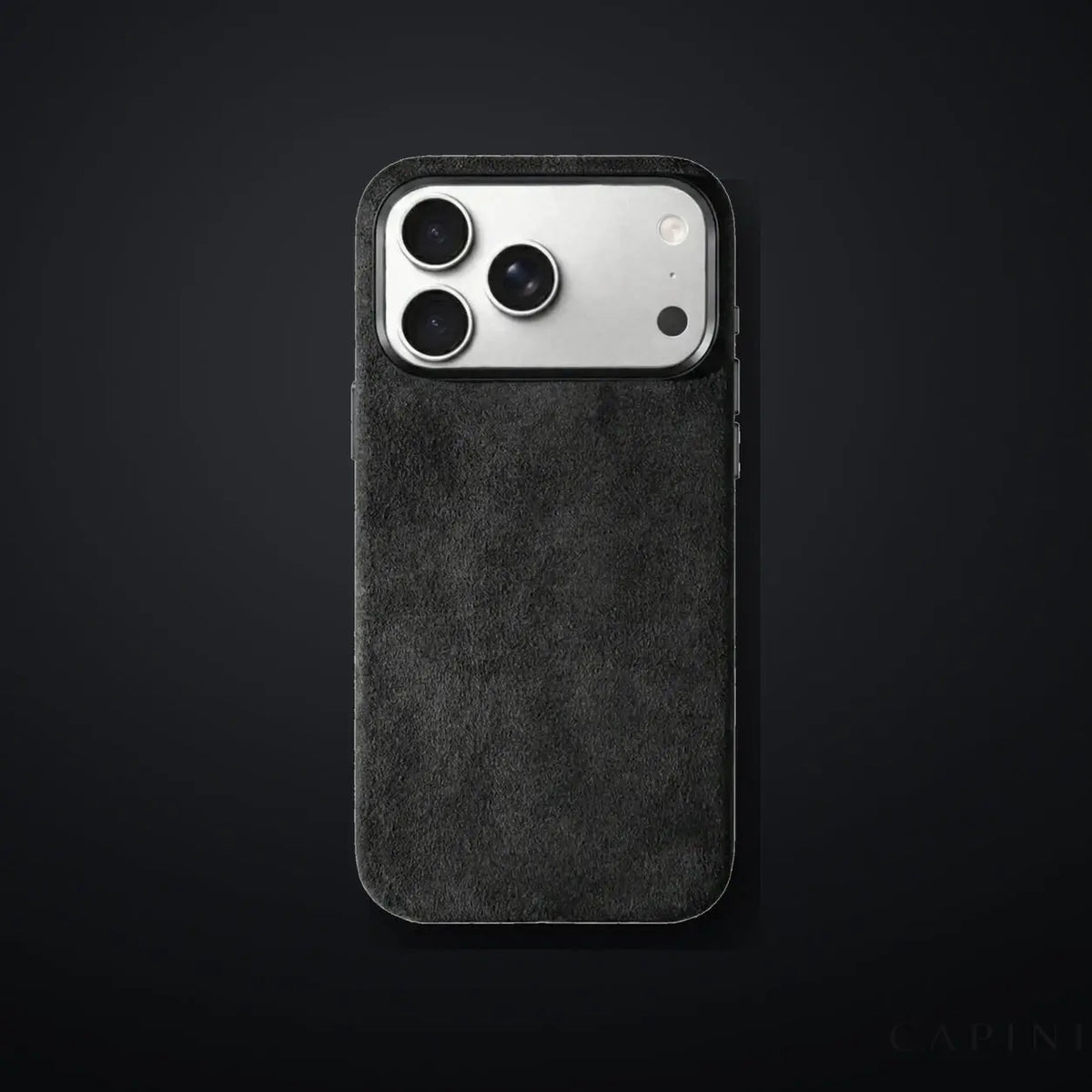 Monaco GT Black Alcantara iPhone case on a charcoal gradient | CAPINI_GRID_EDITORIAL_20260926