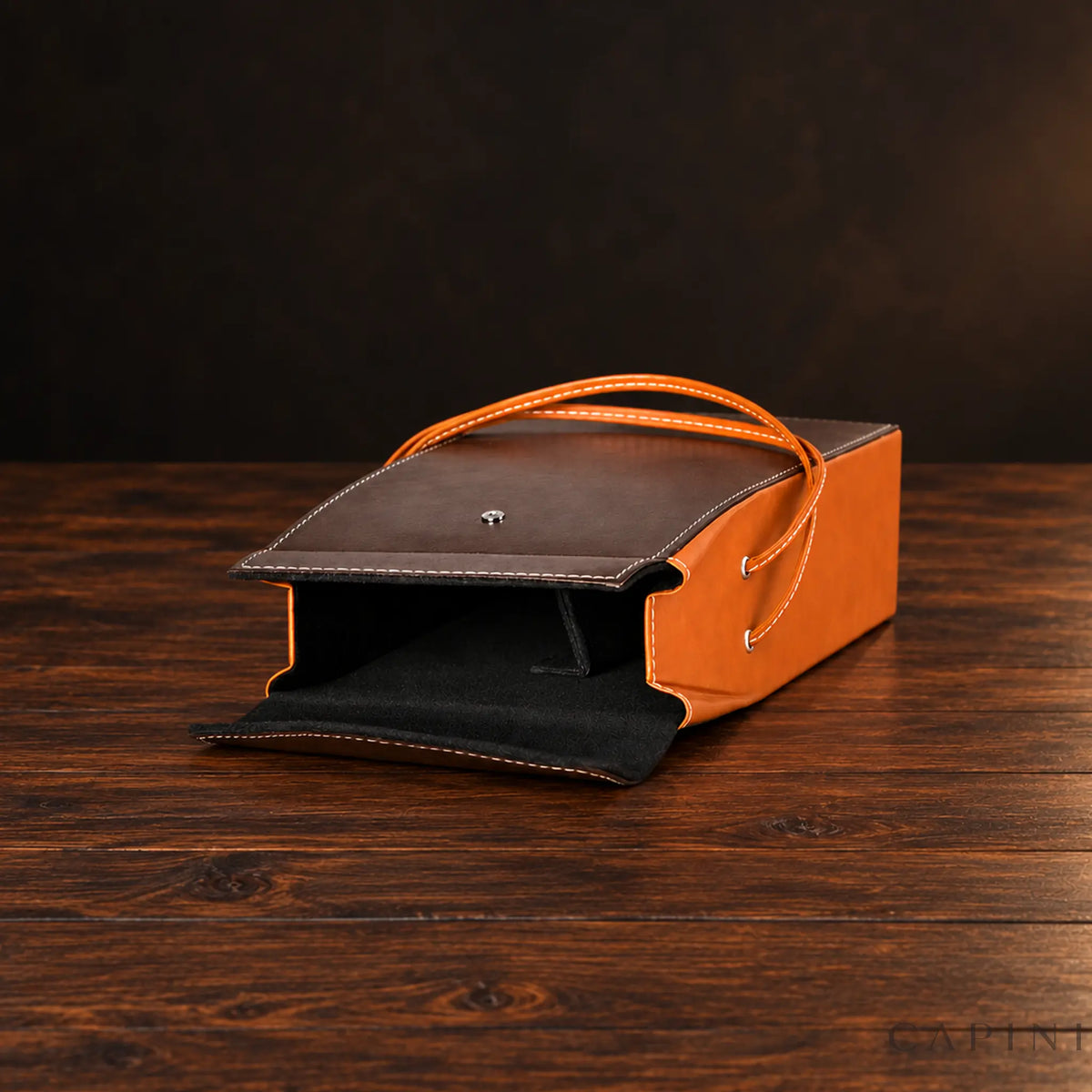 Pollenzo two-bottle tote showing black lining, silver snap and stitched handles