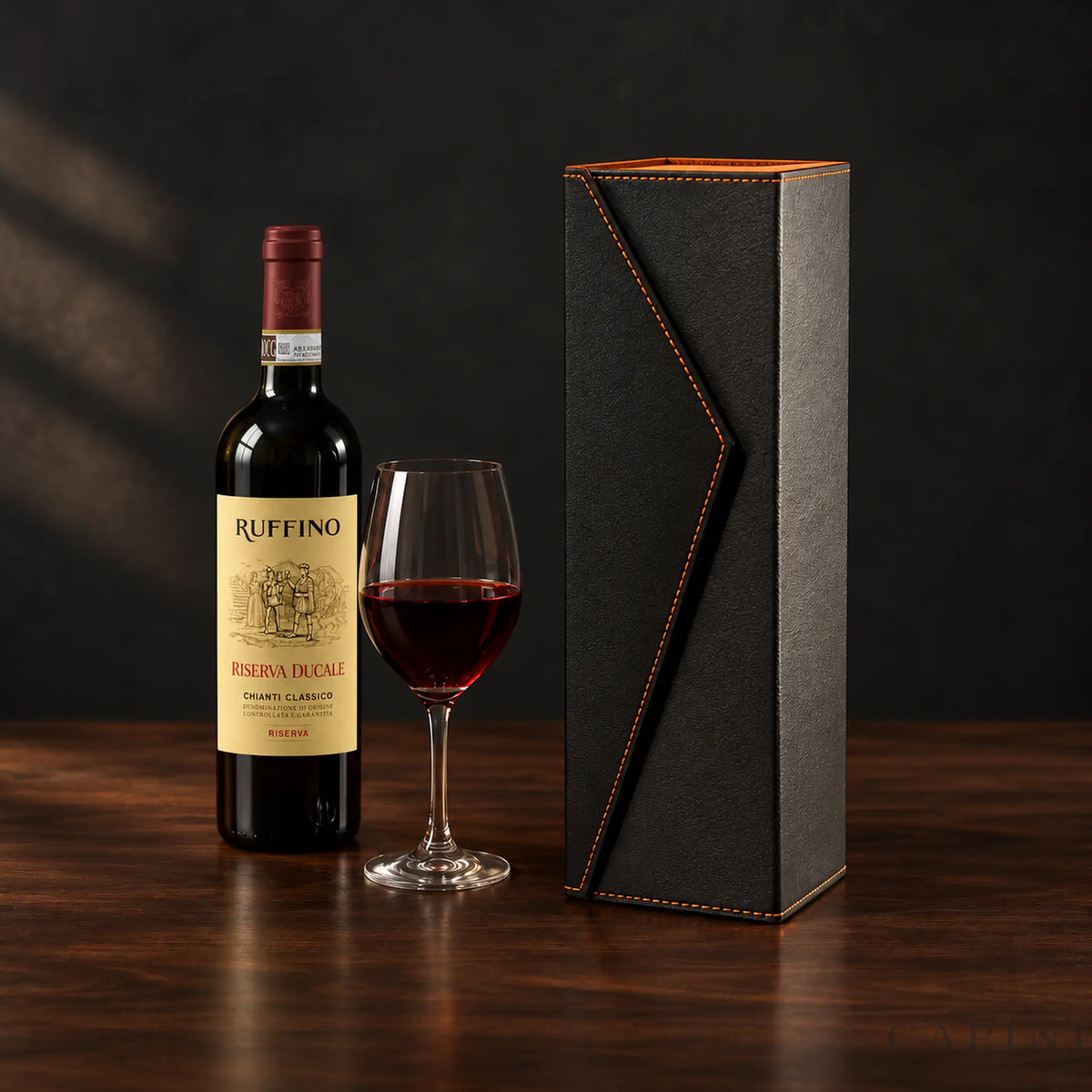 Radda Black wine gift box with orange stitching beside Ruffino Riserva Ducale