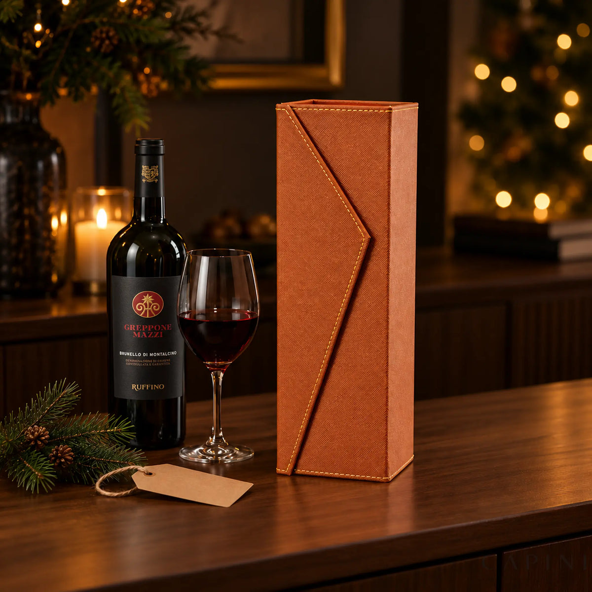 Radda Cognac gift box beside Greppone Mazzi Brunello in a Christmas setting