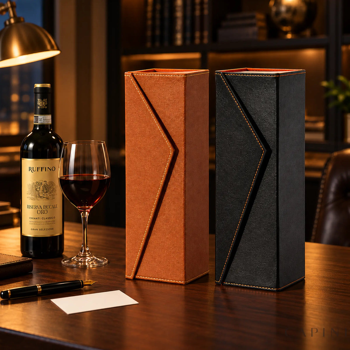 Radda Cognac and Black wine gift boxes beside Ruffino Riserva Ducale Oro on a desk