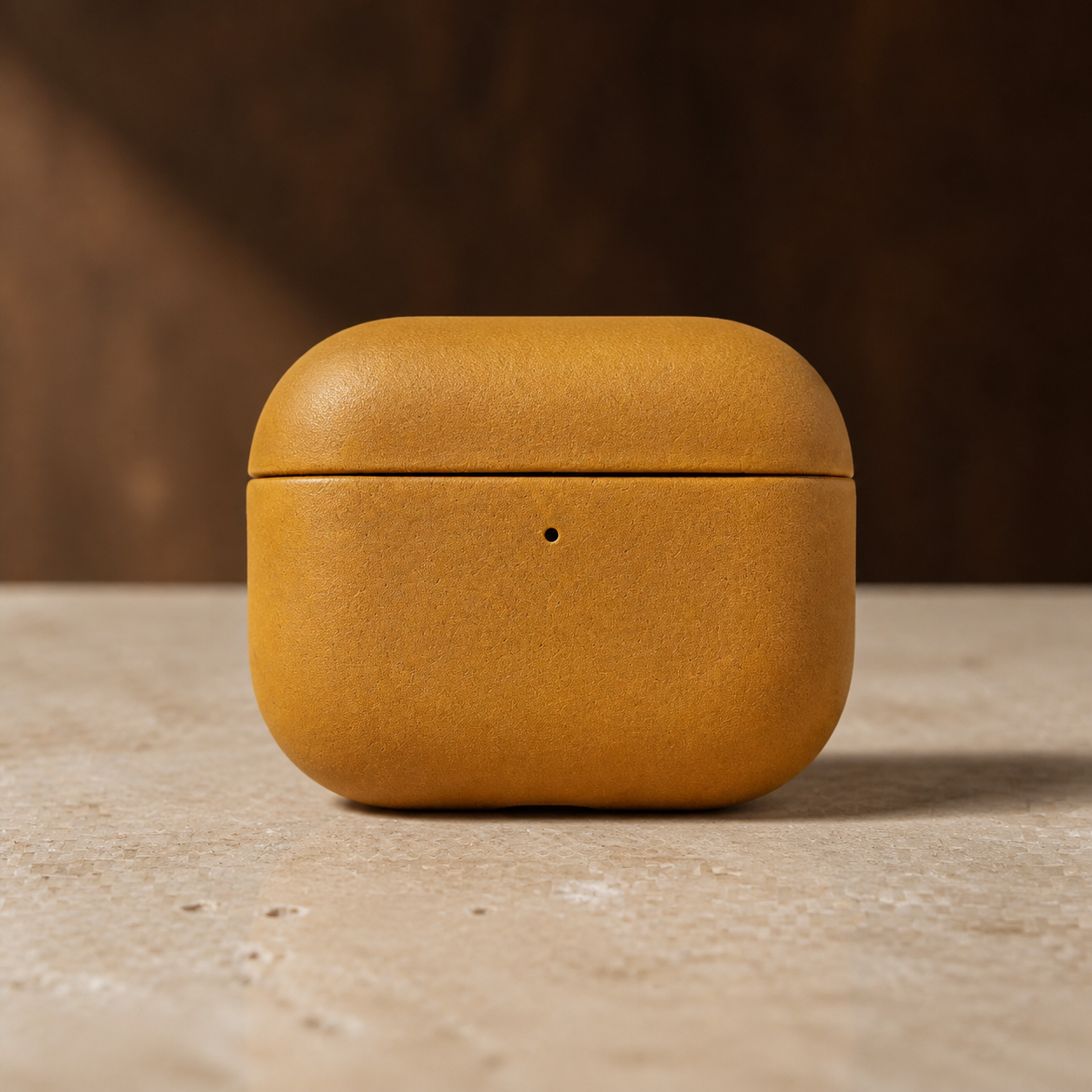Orvieto AirPods leather case in Ochre, closed front view