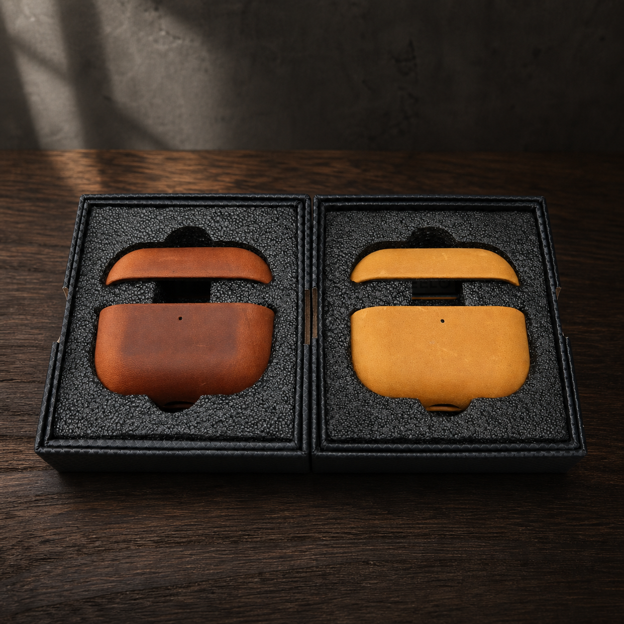 Orvieto Cocoa and Ochre leather AirPods cases in premium packaging