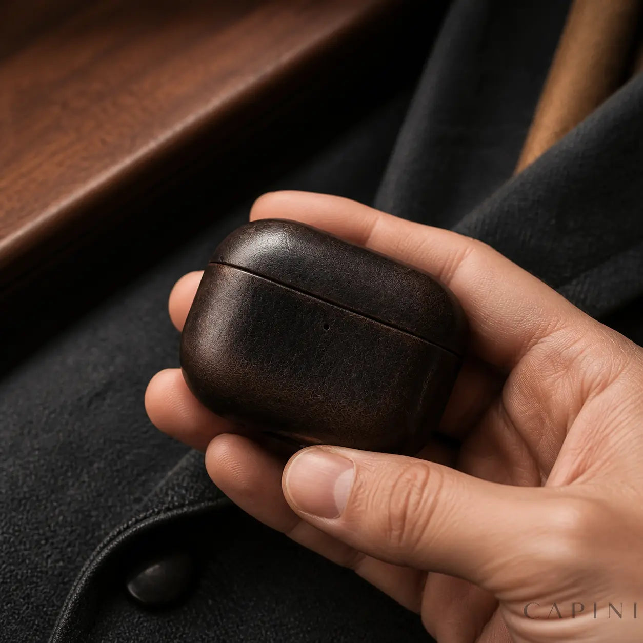 York Full-Grain Ebony leather case for AirPods Pro 3 shown in hand
