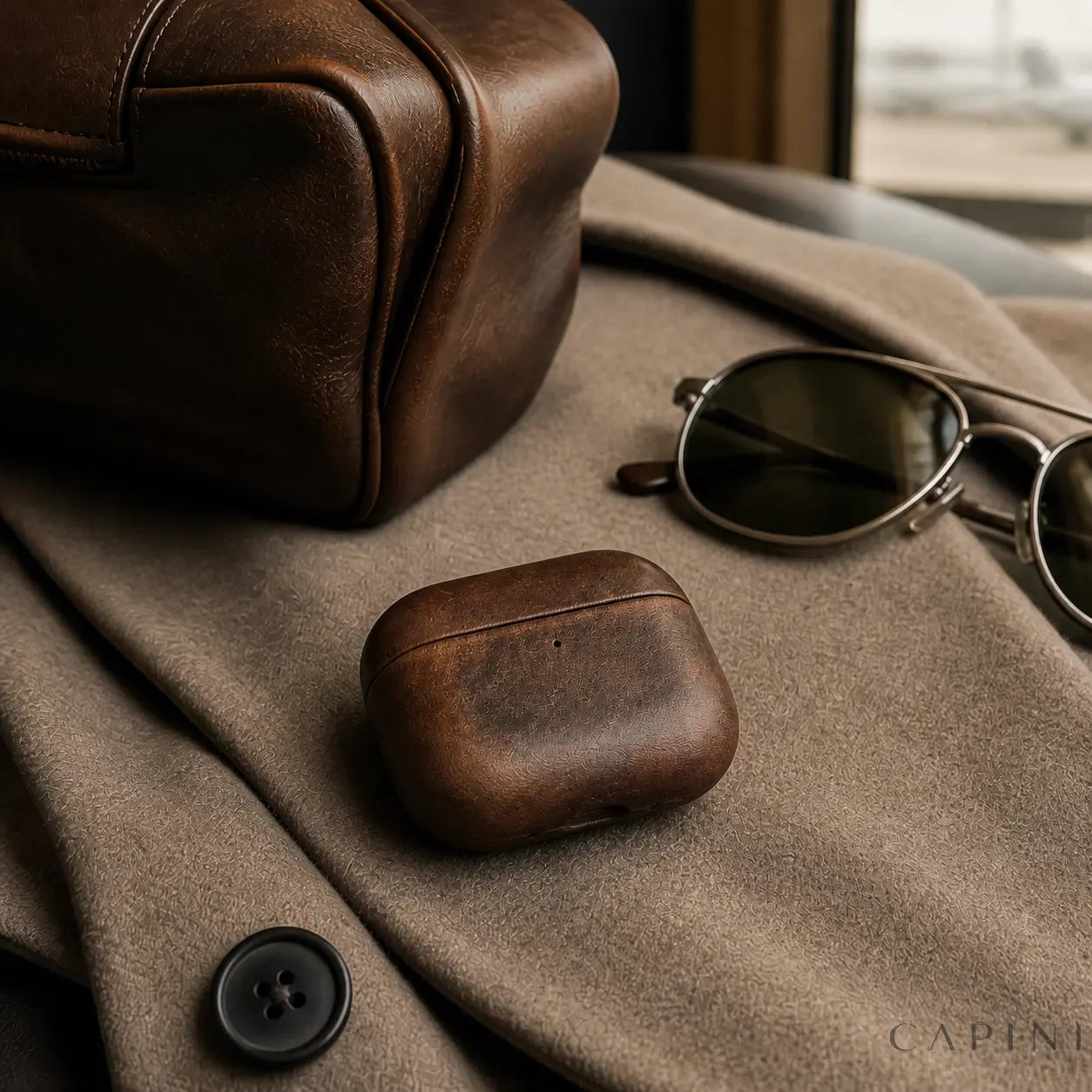 York Full-Grain Matte Brown AirPods Pro 3 case in a travel setting