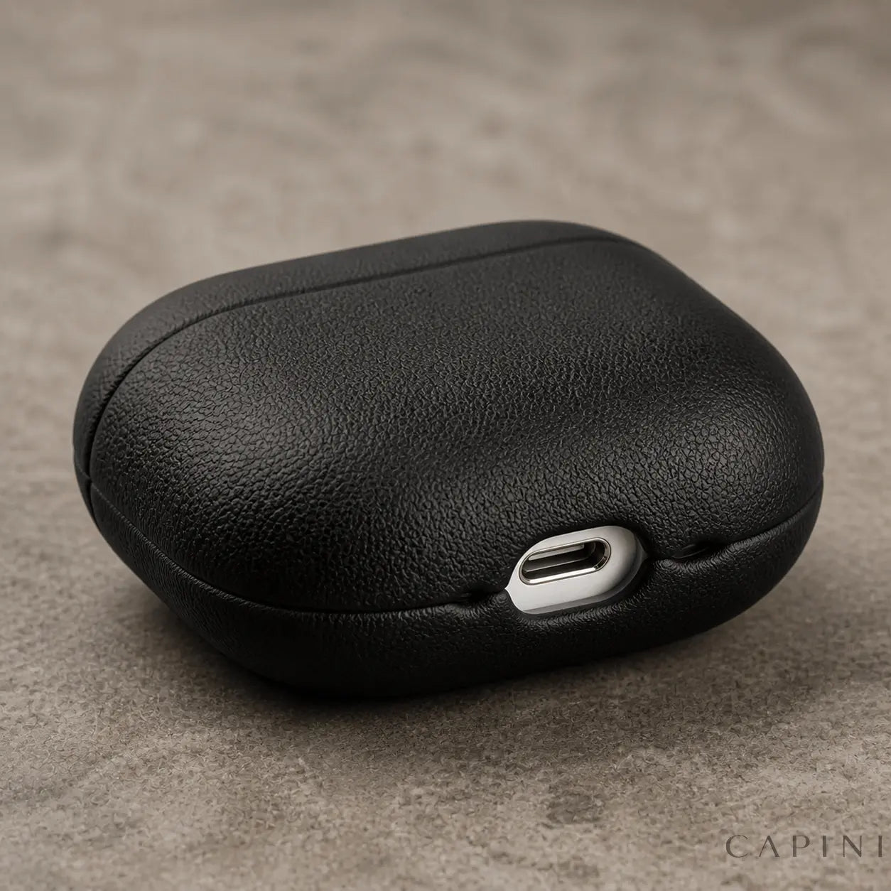 Pesaro Fine Grain black AirPods 4 leather case USB-C cutout