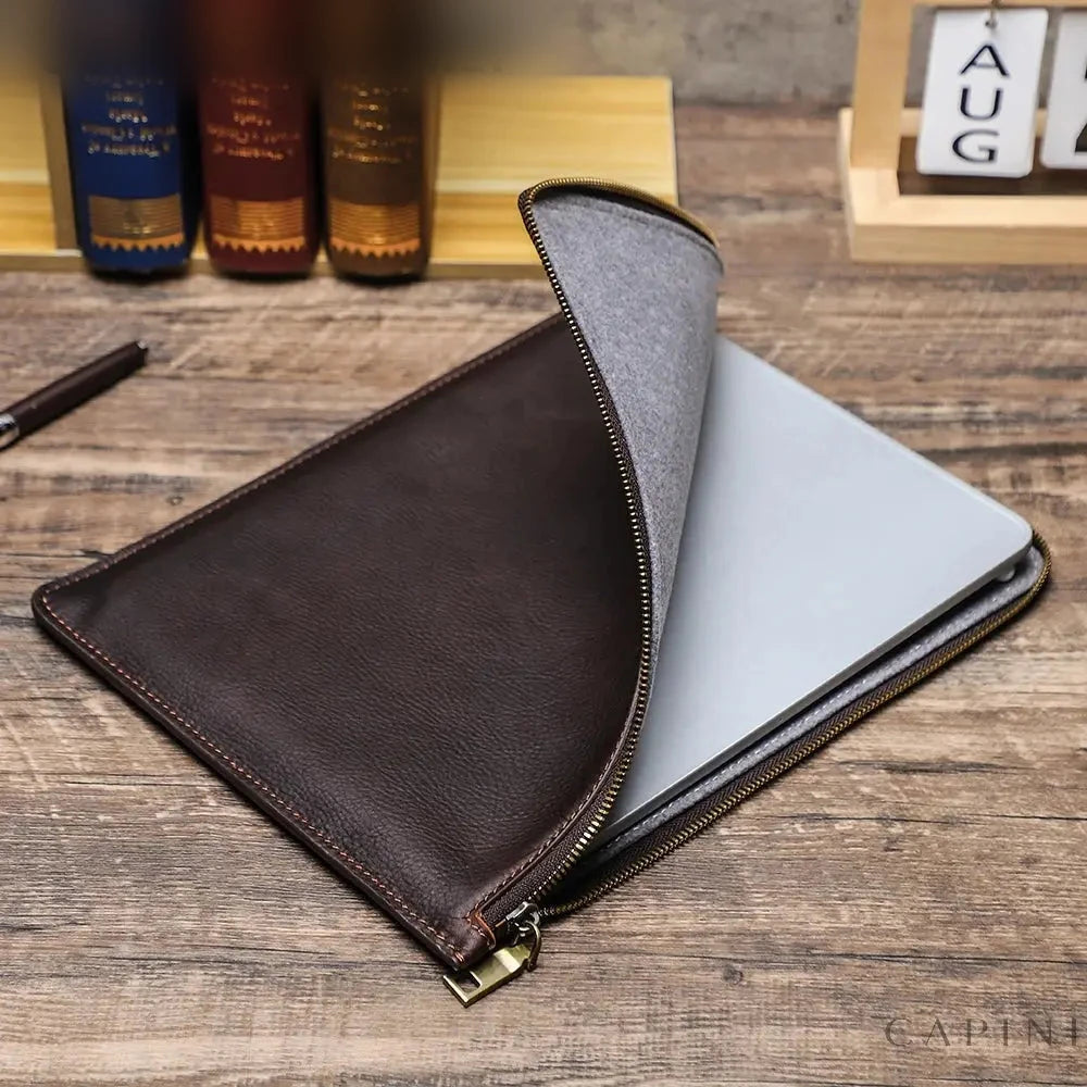 Tolentino Oil-Wax iPad Zip Folio open on a wooden desk, grey velvet lining and metal zip