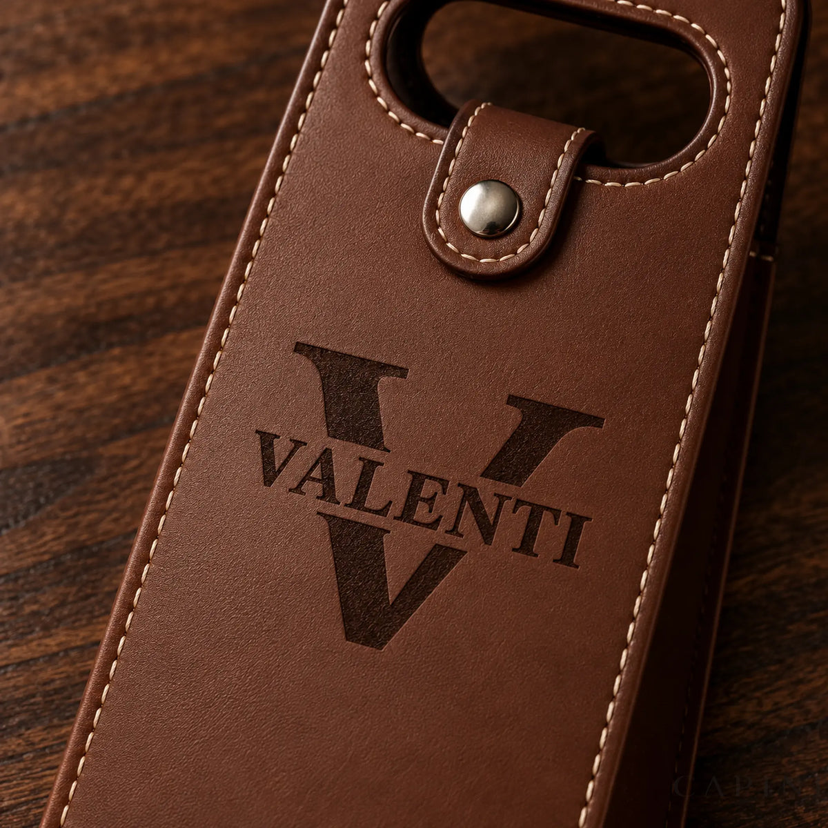 Macro view of Conegliano Espresso stitching, silver snap and Valenti laser engraving