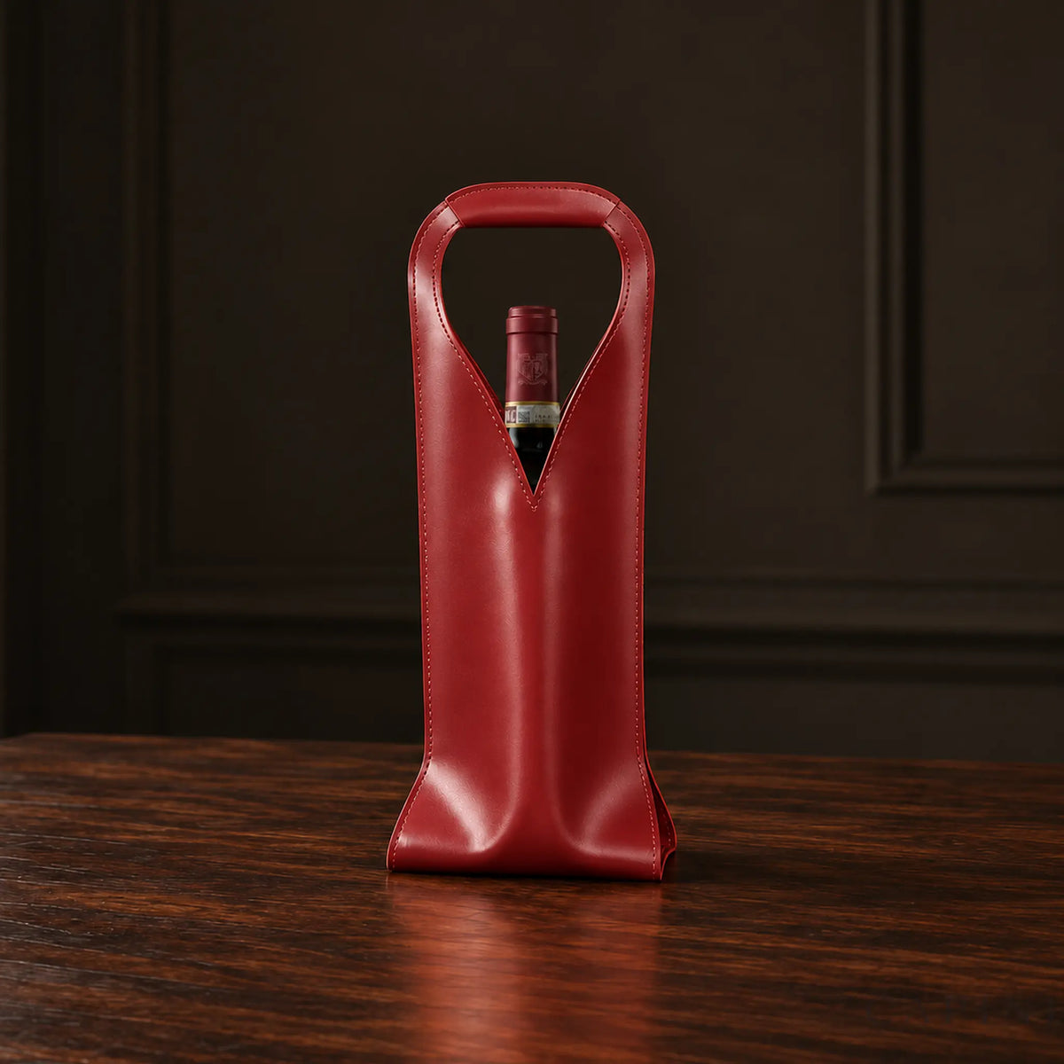 Cormons Loop Handle wine carrier in Burgundy on dark walnut