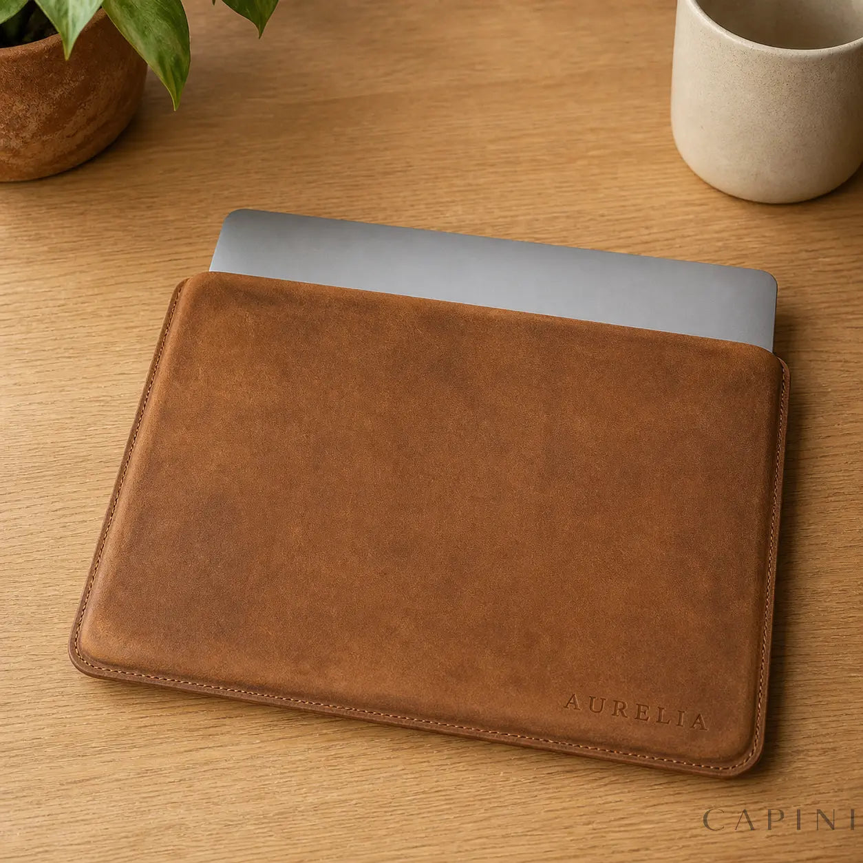 Pavia Cowhide MacBook Sleeve in cognac leather with subtle personalisation placement