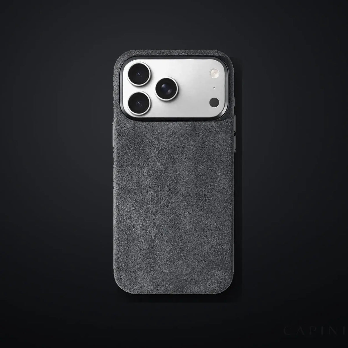 Monaco GT Dark-Grey Alcantara iPhone case on a charcoal gradient | CAPINI_GRID_EDITORIAL_20260926