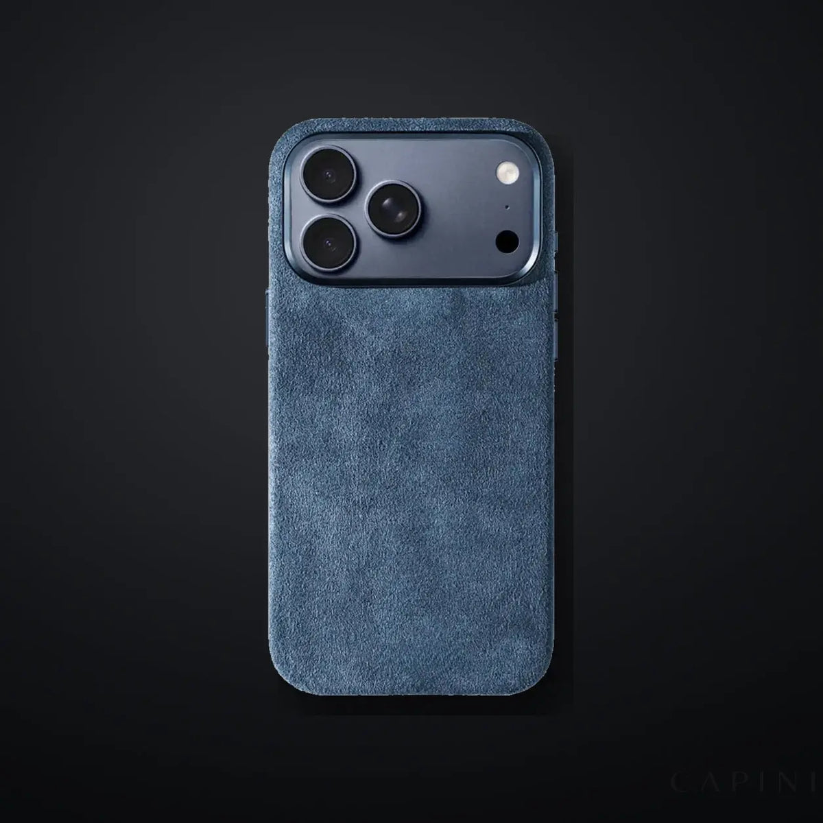 Monaco GT Gray-Blue Alcantara iPhone case on a charcoal gradient | CAPINI_GRID_EDITORIAL_20260926