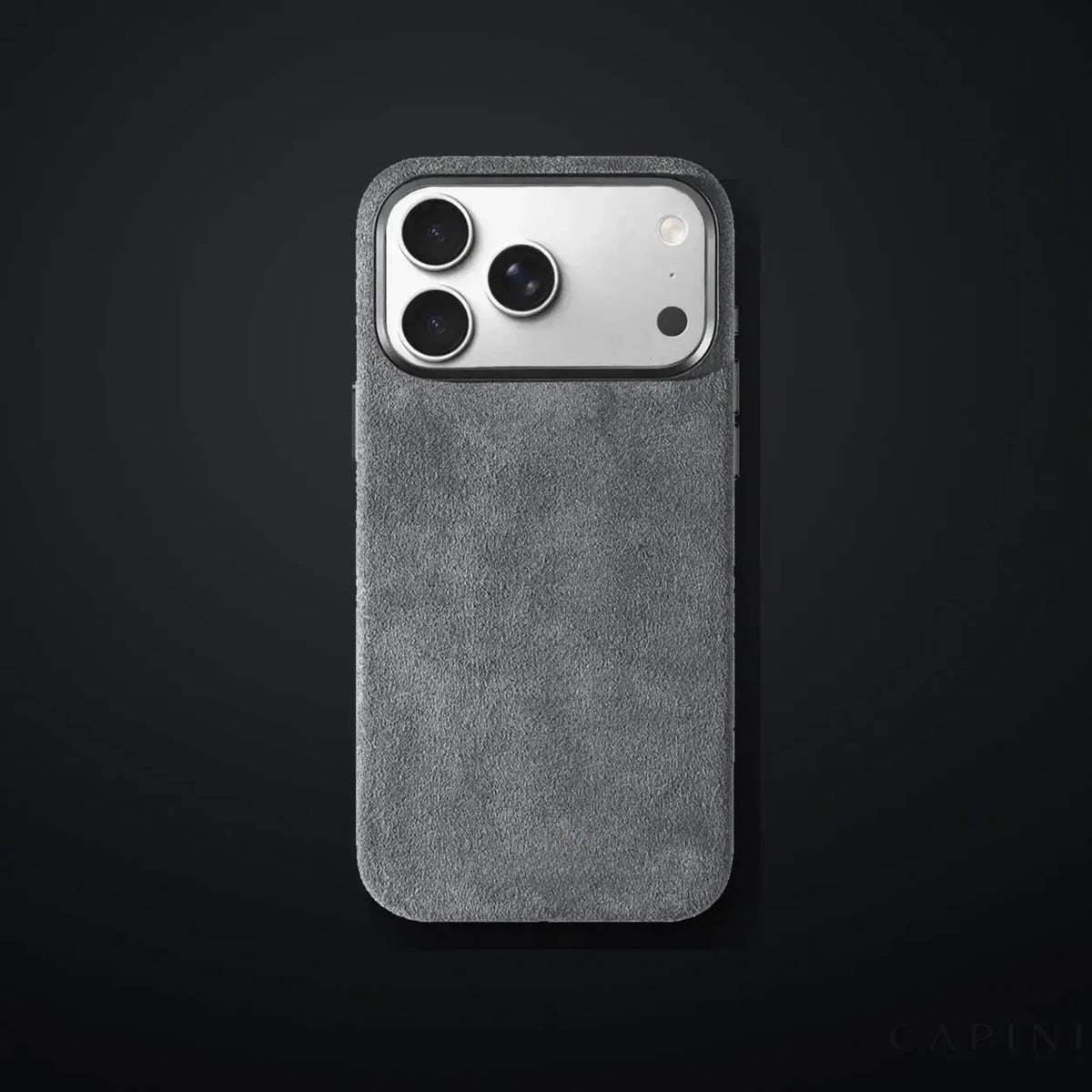Monaco GT Pale-Grey Alcantara iPhone case on a charcoal gradient | CAPINI_GRID_EDITORIAL_20260926