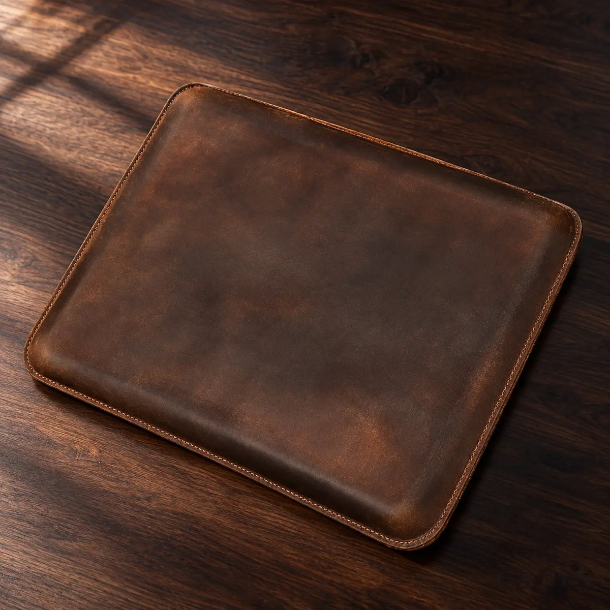Pavia Espresso cowhide sleeve on dark walnut, no flap or fastener