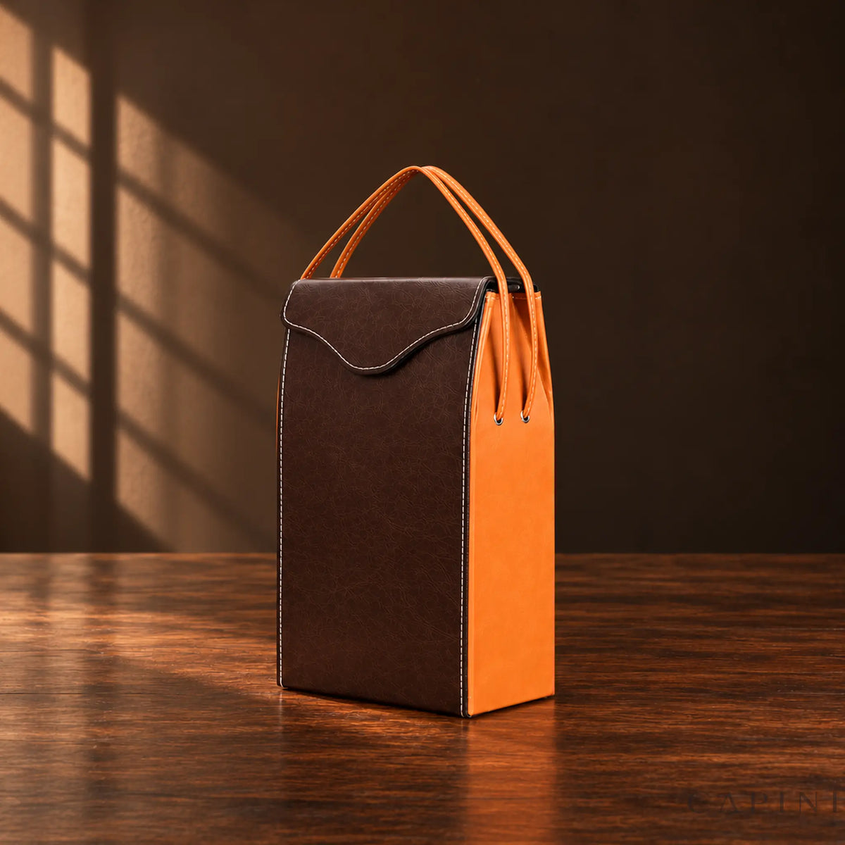 Pollenzo two-bottle wine tote with broad wave flap, chocolate front and caramel sides